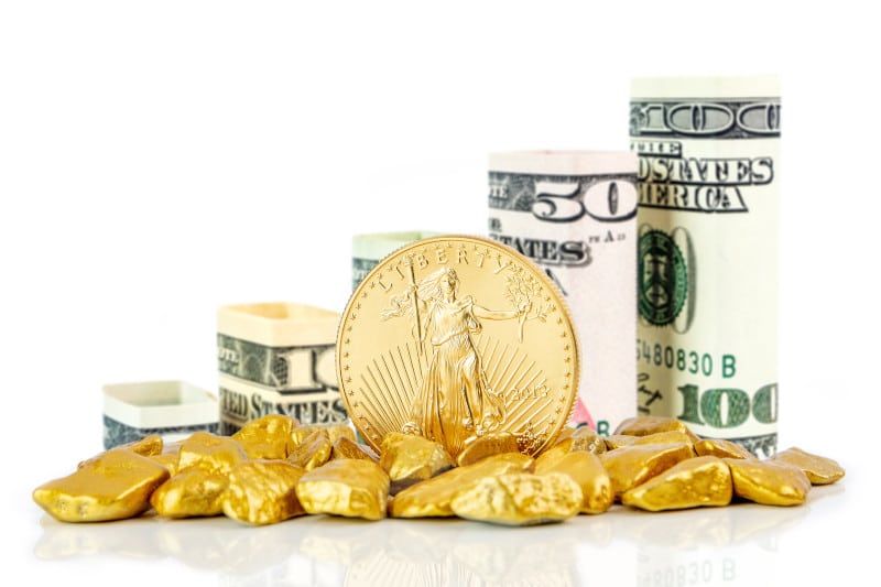 gold coin and US dollar bills