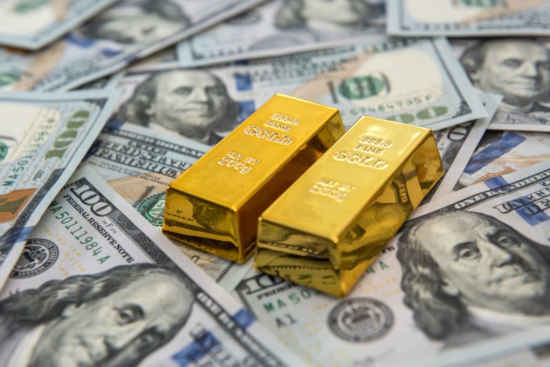 gold bars on $100 bills
